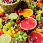 A vibrant assortment of fresh fruits beautifully arranged on a platter, perfect for a healthy and delicious snack.
