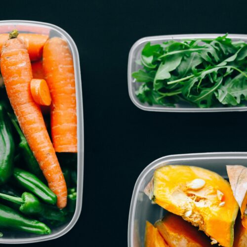Healthy vegetables stored in plastic containers for fresh and nutritious meals.